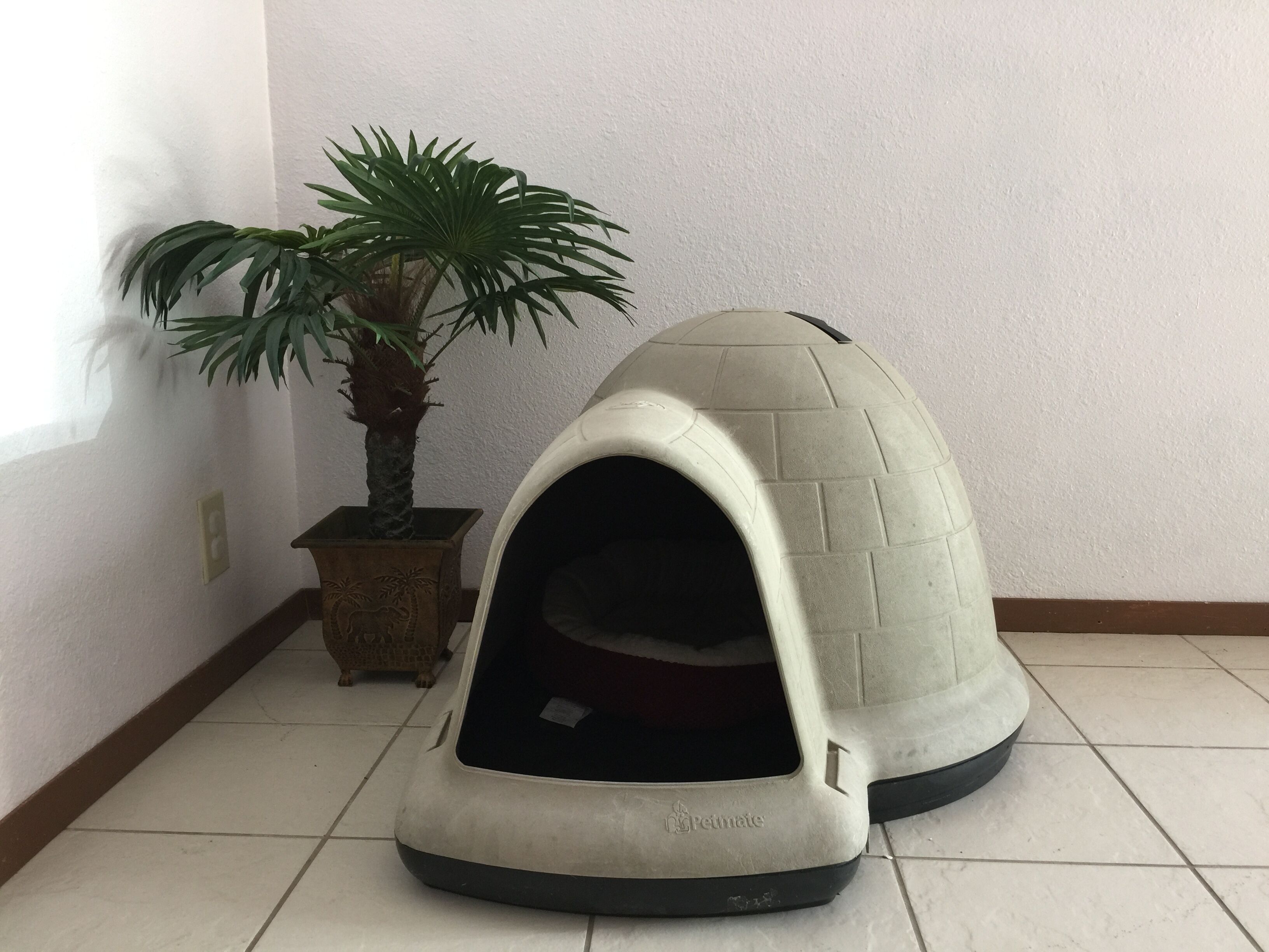 A pet house with a dome roof and a small entrance.