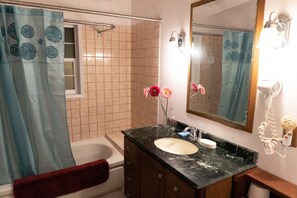 Combined shower/bathtub, hair dryer, towels, soap