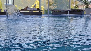 Indoor pool, pool umbrellas, pool loungers
