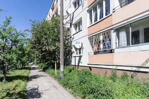 Residential building with a secure balcony and serene surroundings.