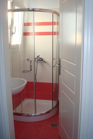 Shower, free toiletries, hair dryer, slippers