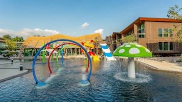 Enjoy the fun of a mushroom-shaped fountain and colorful slides in a well-maintained outdoor play area.