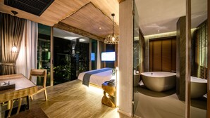 A modern bedroom with a large bed, a wooden ceiling, a dining area, and a bathroom with a large bathtub. - Kalima Resort & Villas Khaolak (Thai Mueang)