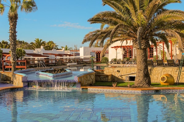 Outdoor pool, open 10 AM to 6 PM, pool umbrellas, pool loungers