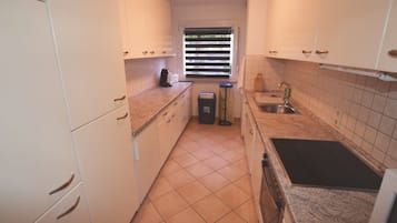 Apartment, 2 Bedrooms (85-00) | Private kitchen | Fridge, stovetop, dishwasher, coffee/tea maker