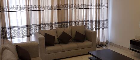 Apartment, 2 Bedrooms | Living room | Flat-screen TV