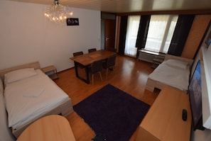 Apartment, 2 Bedrooms (39-00) | Living room | Flat-screen TV