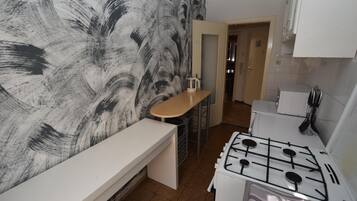 Fridge, stovetop, coffee/tea maker, cookware/dishes/utensils