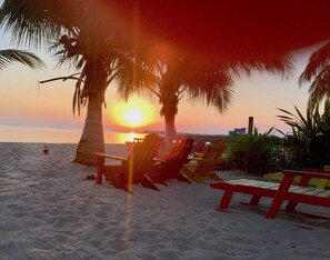 On the beach, sun loungers, beach towels