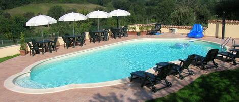 Outdoor pool, open 8 AM to 7 PM, pool umbrellas, sun loungers