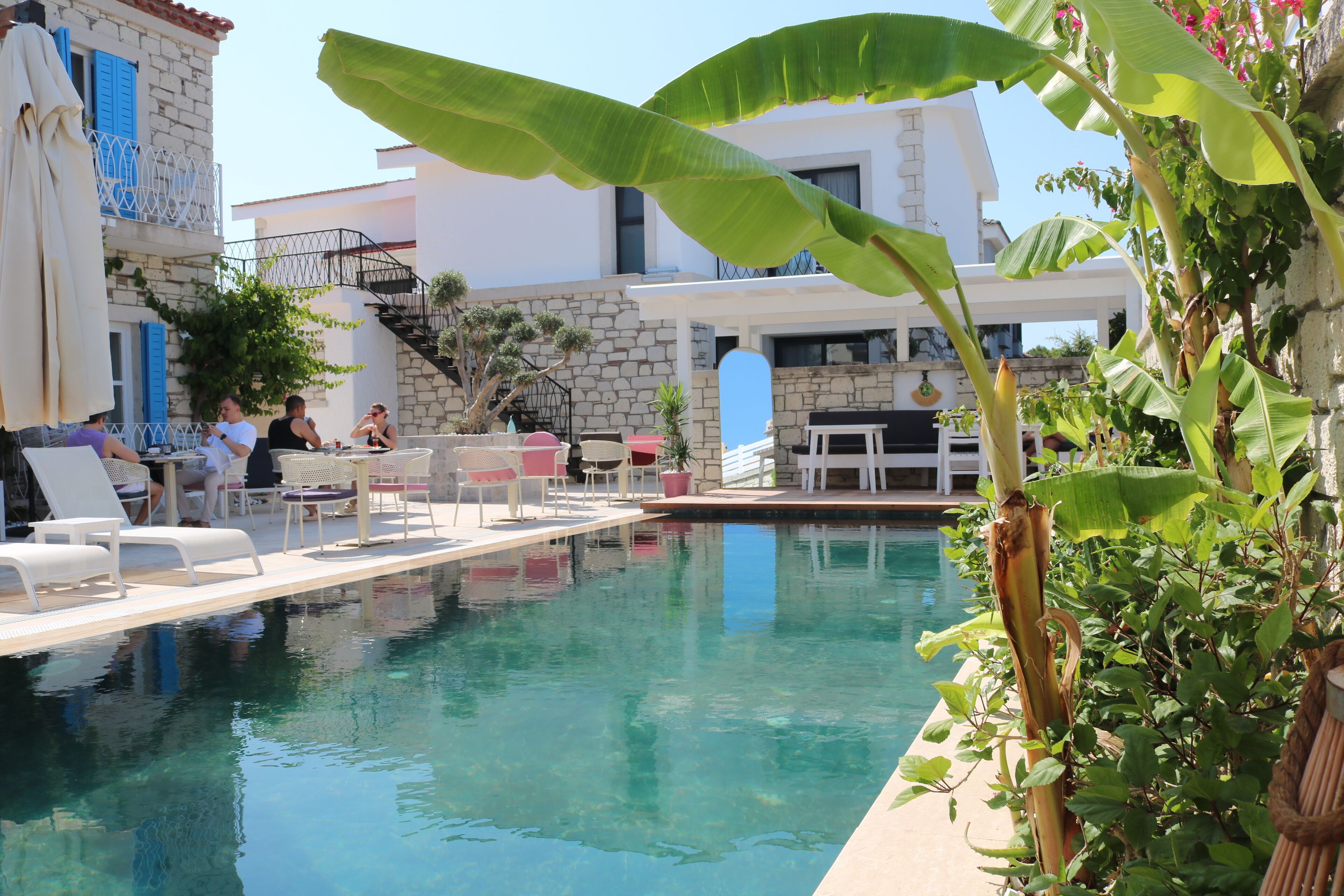 Outdoor pool, open 10:30 AM to 8 PM, pool umbrellas, pool loungers