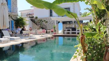 Outdoor pool, open 10:30 AM to 8 PM, pool umbrellas, pool loungers