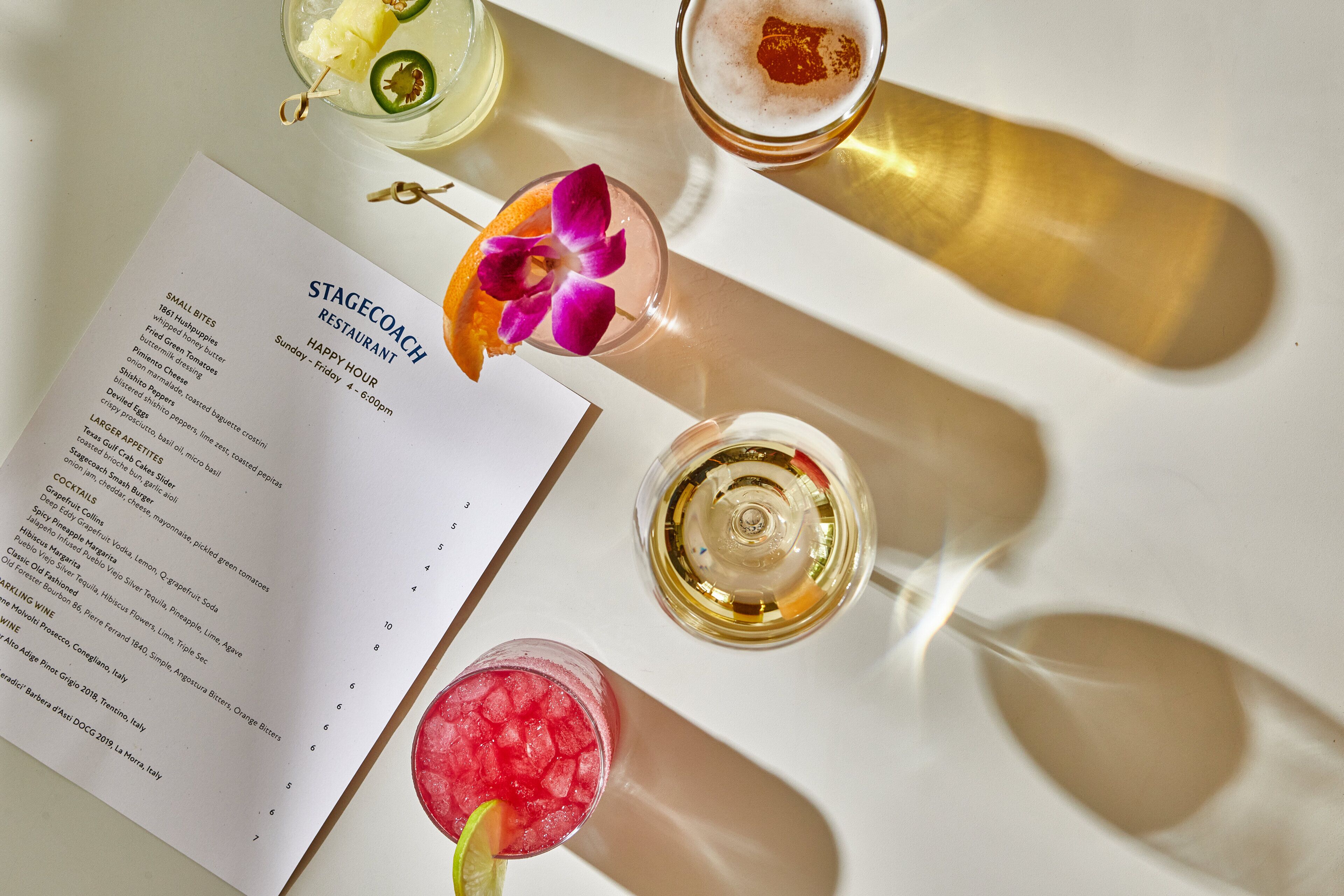 A menu titled "STAGECOACH RESTAURANT" with a list of food items and a selection of cocktails.