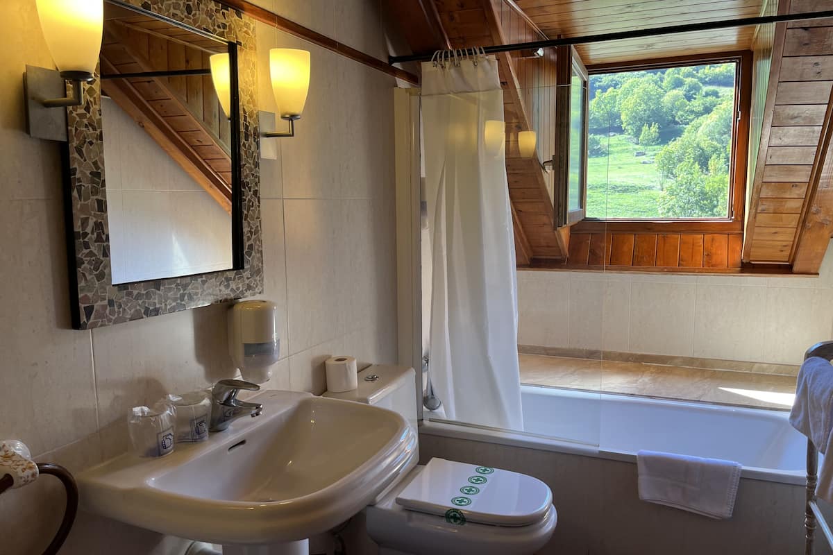 double with balcony - 2 single beds | bathroom | deep-soaking bathtub, rainfall showerhead, free toiletries, hair dryer