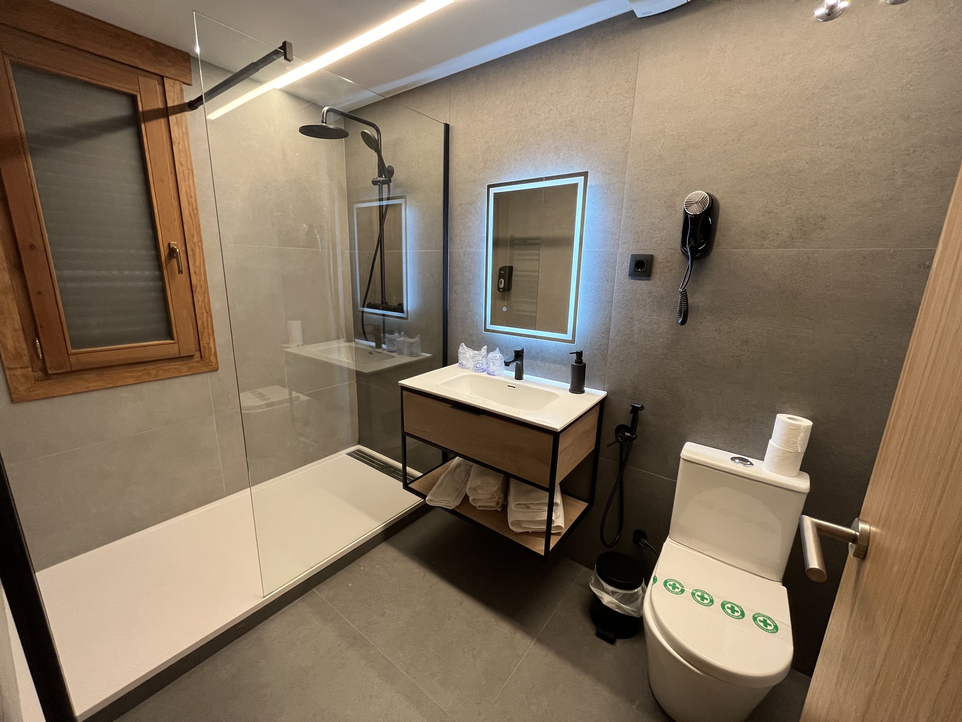 deep-soaking bathtub, rainfall showerhead, free toiletries, hair dryer