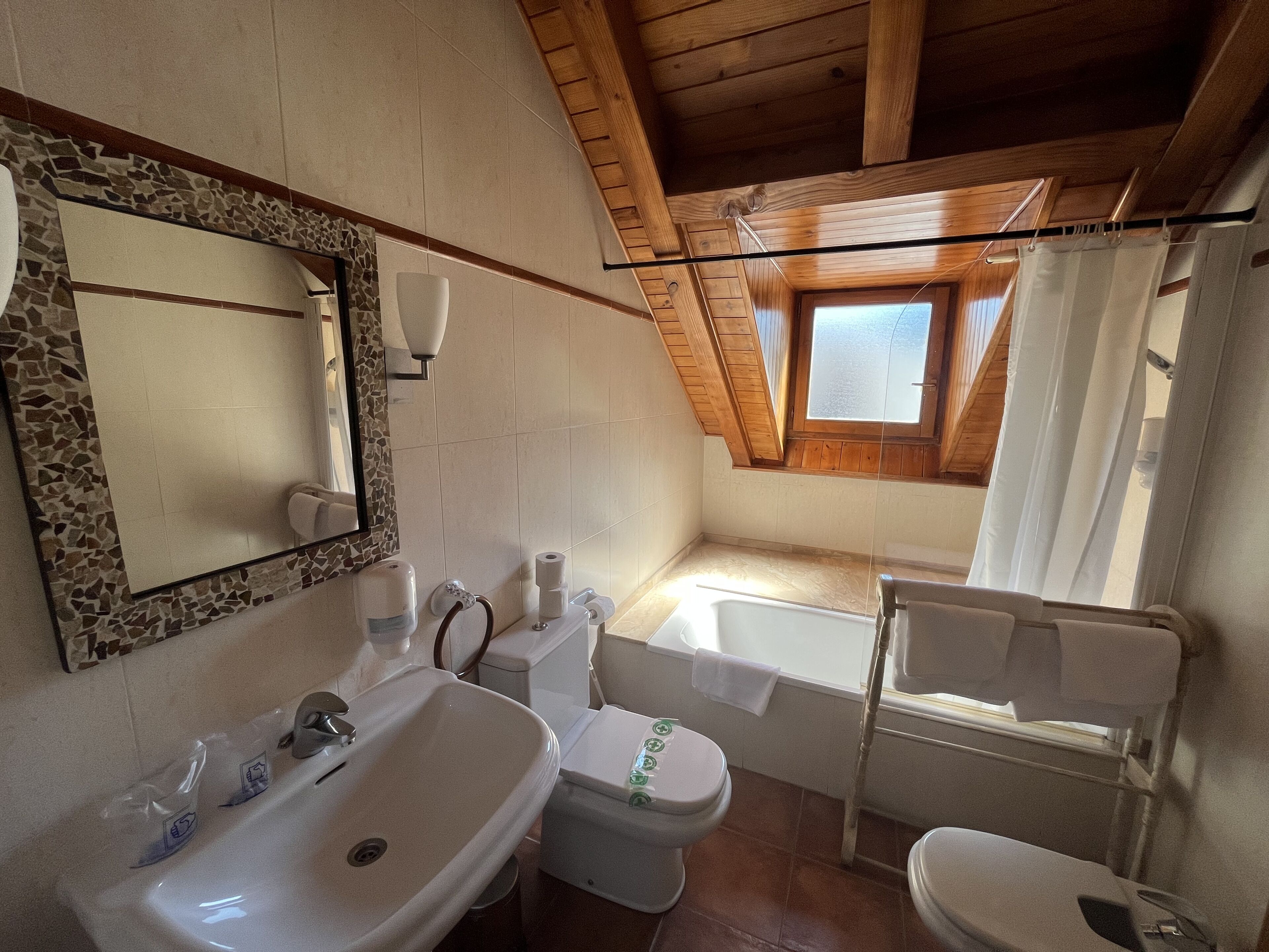 deep-soaking bathtub, rainfall showerhead, free toiletries, hair dryer