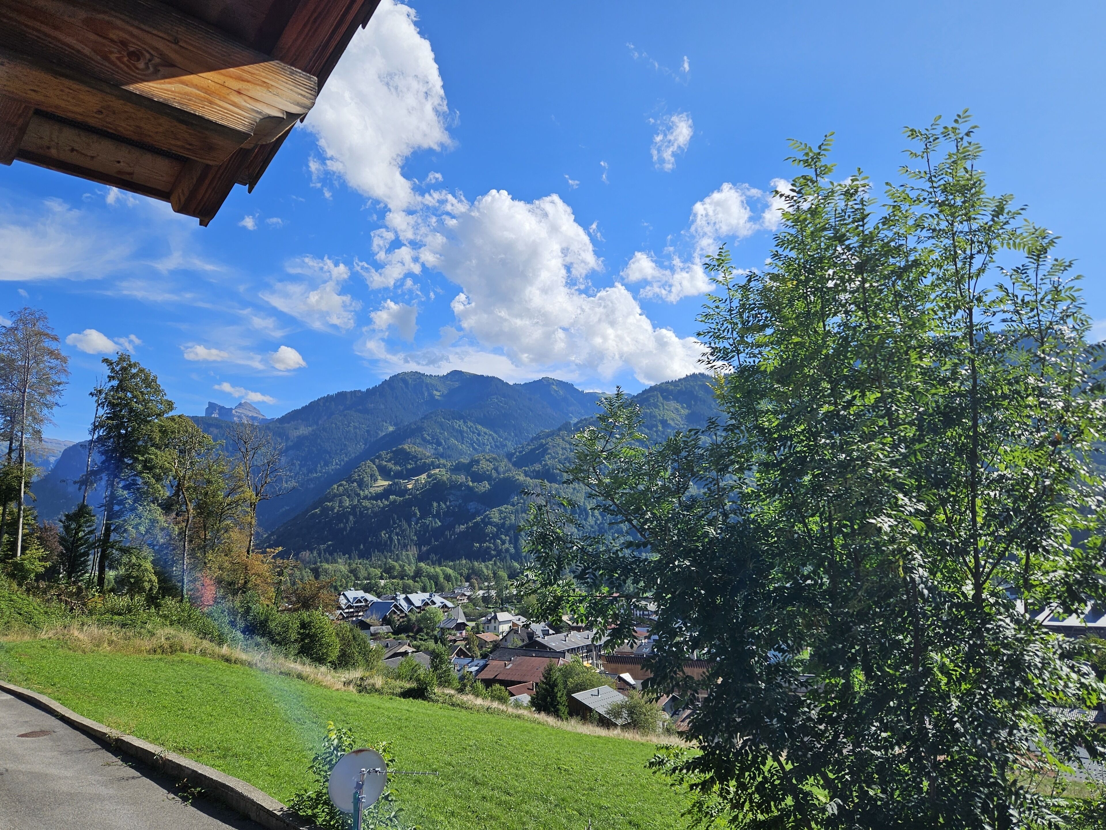 A mountain landscape with a village and houses in the valley.