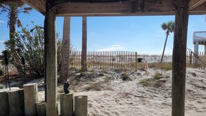 A wooden deck with a view of the beach and a fence. - GULF FRONT PENSACOLA BEACH 4BD/3BA HEATED POOL PET FRIENDLY (Gulf Breeze)