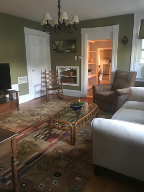 Relax in this inviting living room with a comfortable sofa, coffee table, and television.