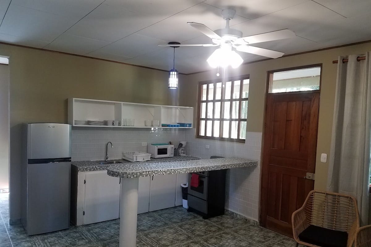 Apartment | Private kitchen | Full-sized fridge, microwave, coffee/tea maker, cookware/dishes/utensils