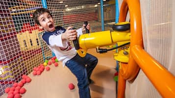 Children can play safely in this enclosed play area with a safety net.