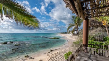 On the beach, sun loungers, beach towels