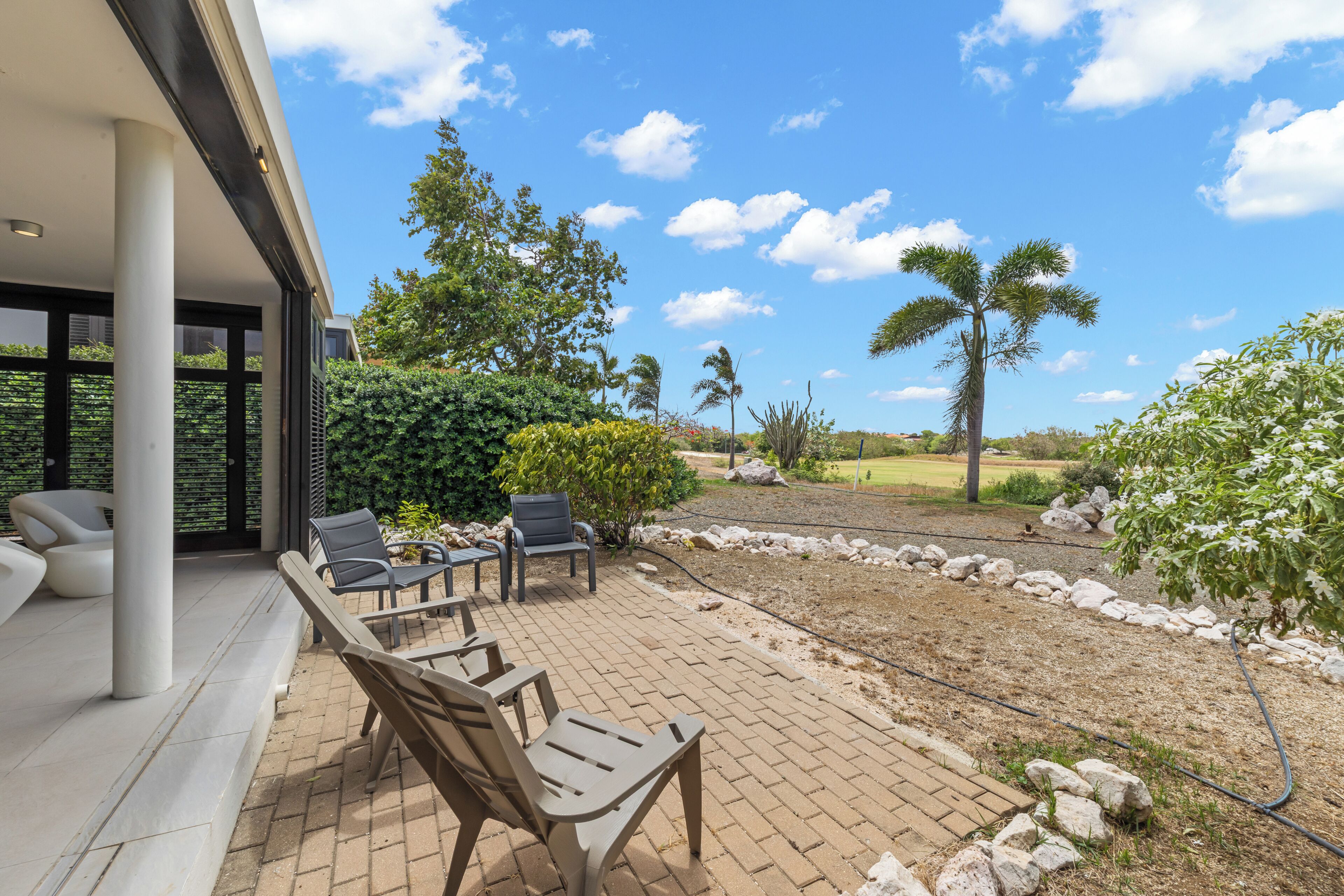 An outdoor patio with seating and a view of the landscape.