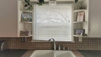 Combined shower/tub, hair dryer, towels, soap