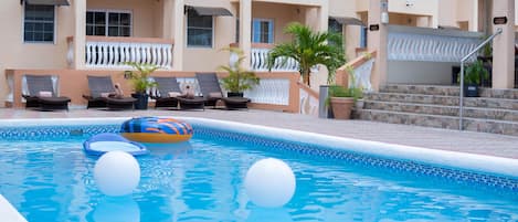 Outdoor pool, pool umbrellas, sun loungers