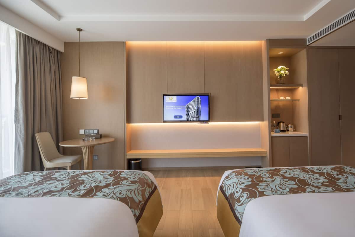Quarto duplo urbano, vista para a cidade | Roupas de cama premium, frigobar, cofres nos quartos, escrivaninha