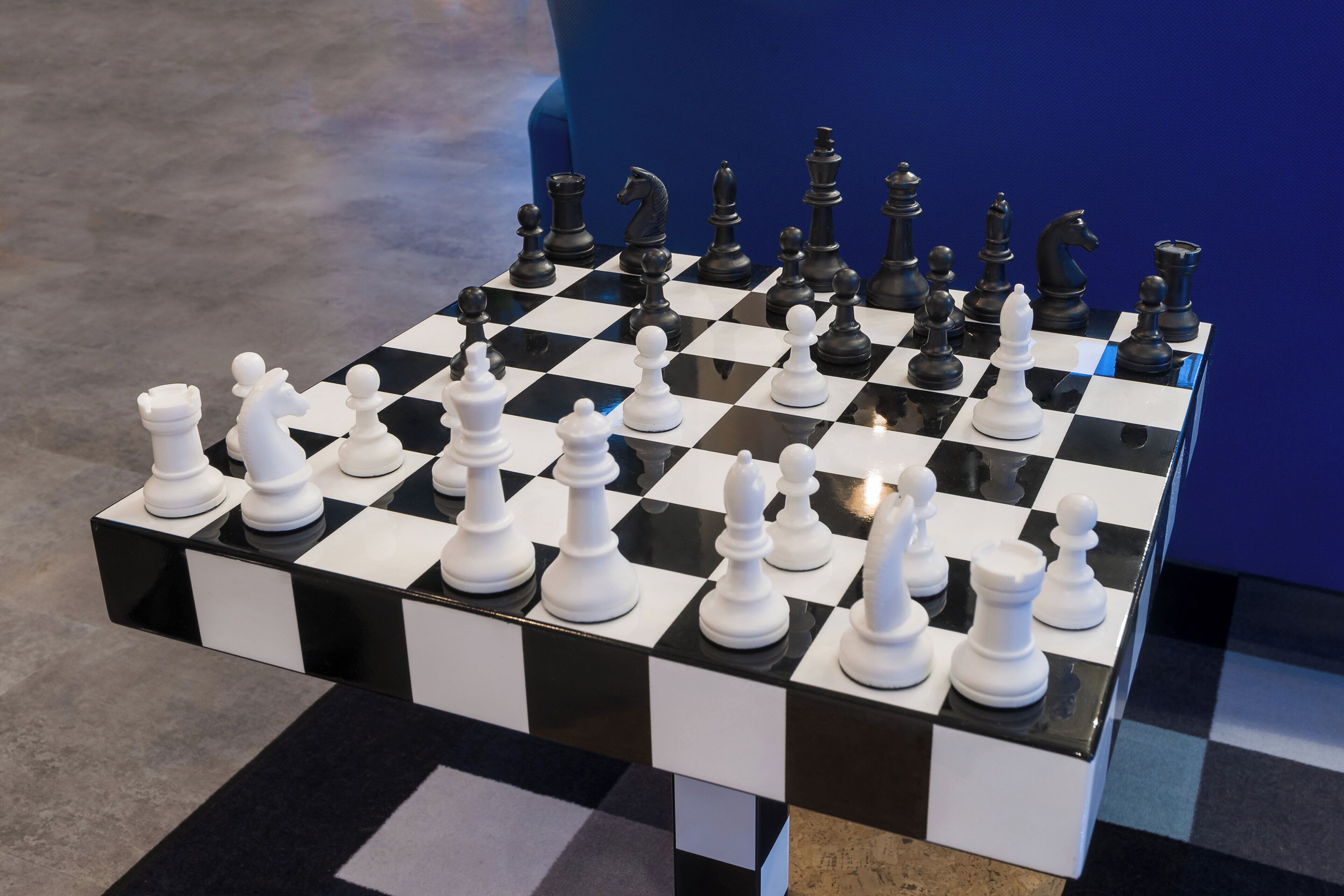 A chessboard with pieces set up for a game.