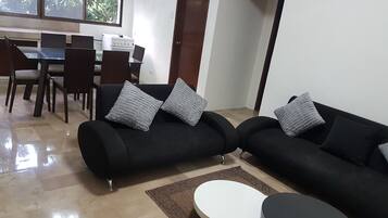 Superior Annex, 2 Bedrooms | Living area | 32-inch LED TV with cable channels, TV