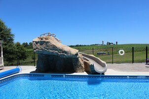 Seasonal outdoor pool, pool umbrellas, pool loungers