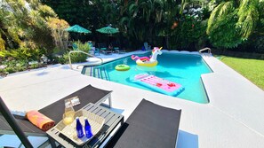 Outdoor pool, a heated pool - POSHPADZ Hot Tub, Tropical Pool, Pool Floats, 3 Bedrooms, BBQ, Minutes to Beach (Palm Beach Gardens)