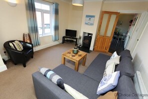 Cottage | Living area | TV, fireplace, DVD player, iPod dock