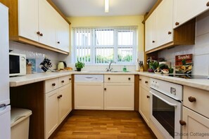 Cottage | Private kitchen | Oven, stovetop, dishwasher, coffee/tea maker - Braunton Nook 2 Bedrooms (Braunton)
