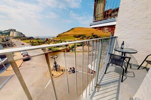 Relax on the balcony with a view of the surrounding landscape and unique architecture.