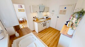 Cottage | Private kitchen | Fridge, microwave, oven, stovetop - Ilfracombe Eden 2 Bedrooms (Ilfracombe)