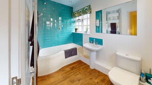 Shower, deep-soaking bathtub, hair dryer, towels