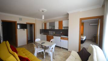 Apartment, 1 Bedroom | Living area | LCD TV