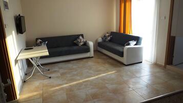 Apartment, 1 Bedroom | Living area | LCD TV