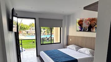 Habitación Confort, 1 cama Queen size | Ropa de cama