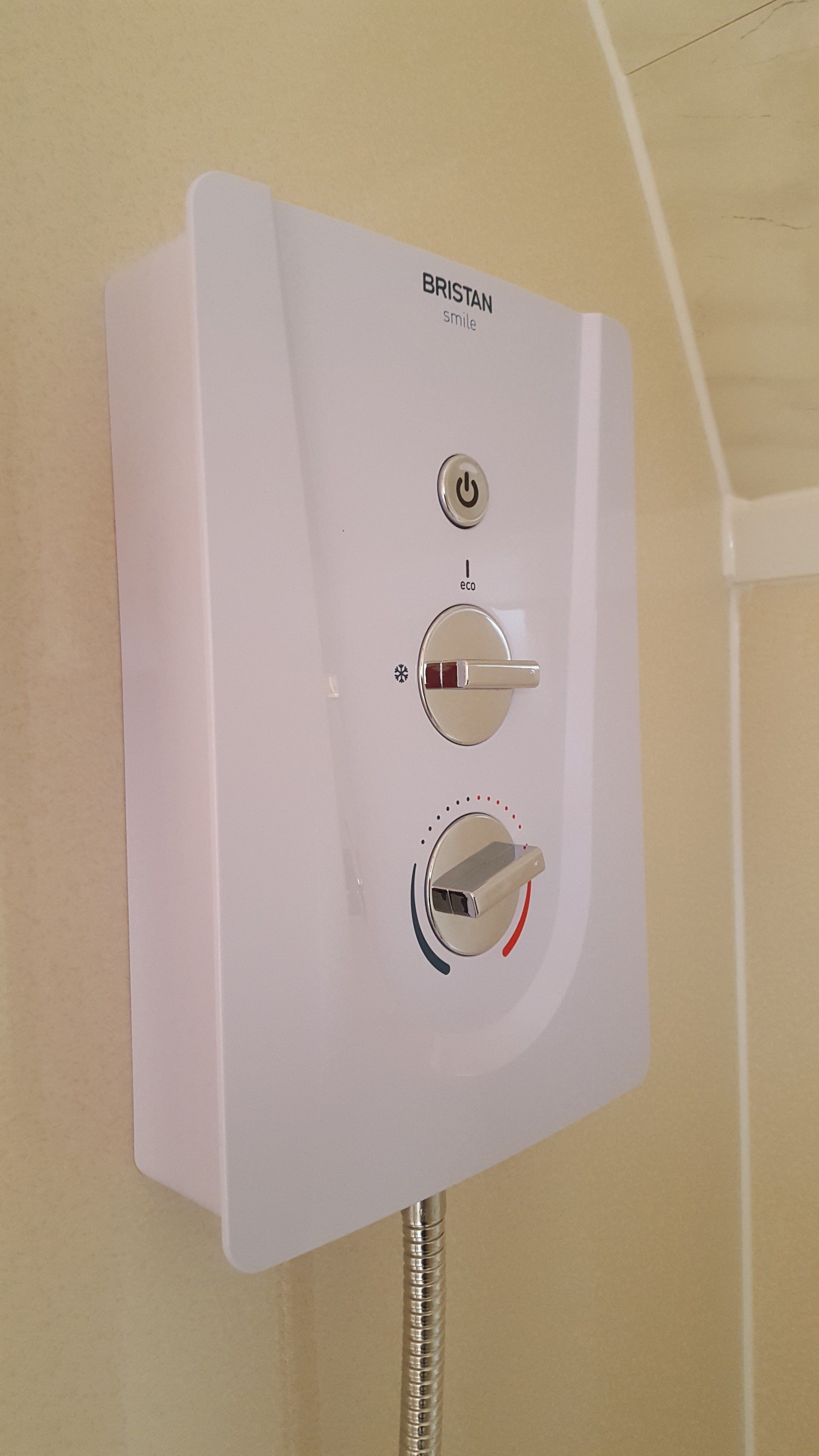 A white BRISTAN water heater with a power button, eco mode switch, and a temperature control knob.