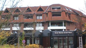 A building with a sign reading "Ernst-Moritz-Arndt-Haus". - Apartment at the harbor, Germany (Lübeck)
