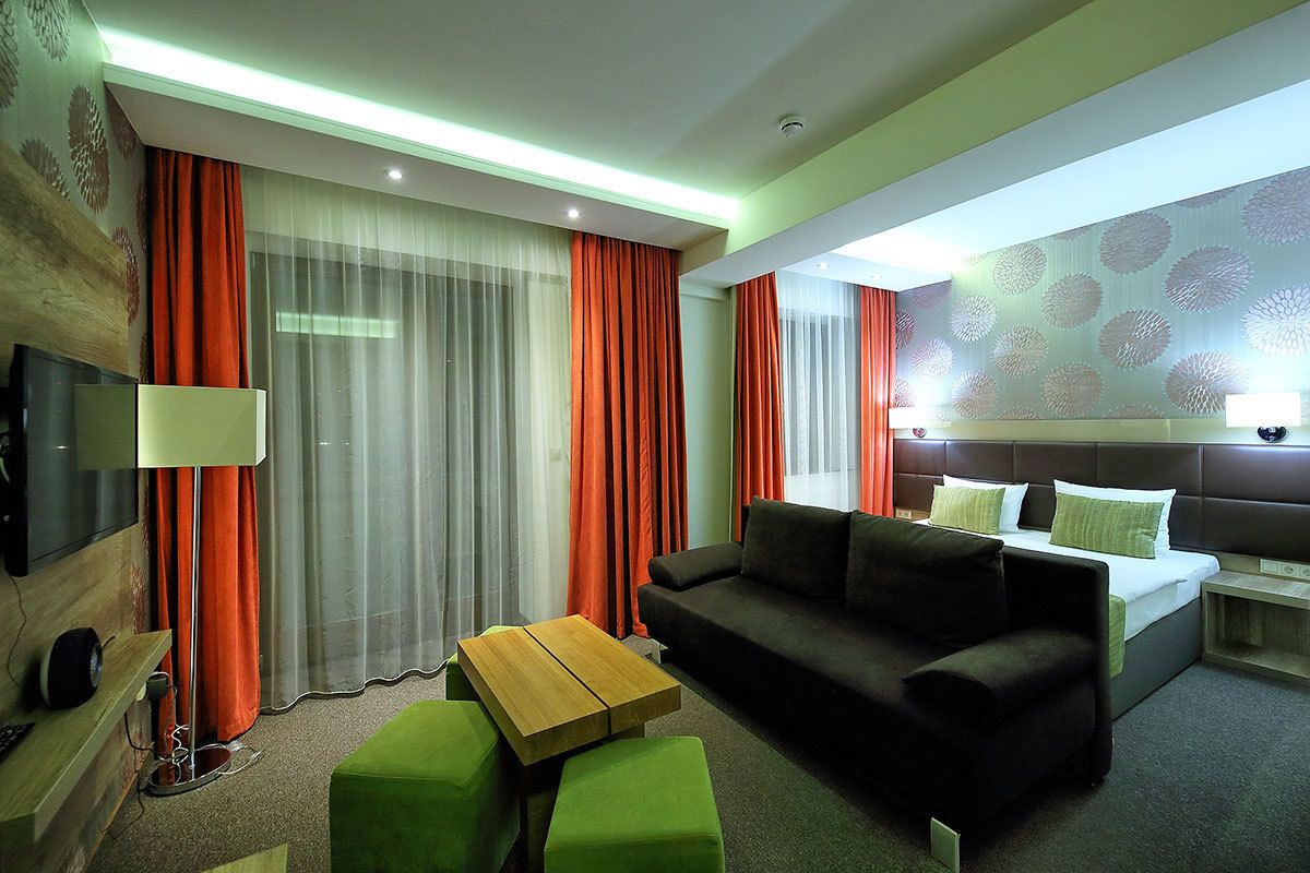 Superior Double Room, Balcony | Living area | 80-cm LCD TV with cable channels, TV