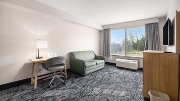 Desk, iron/ironing board, bed sheets