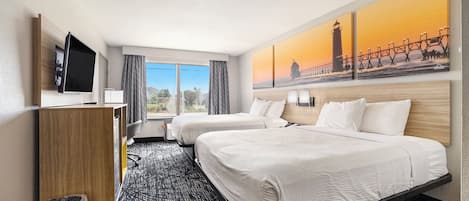 Desk, iron/ironing board, bed sheets