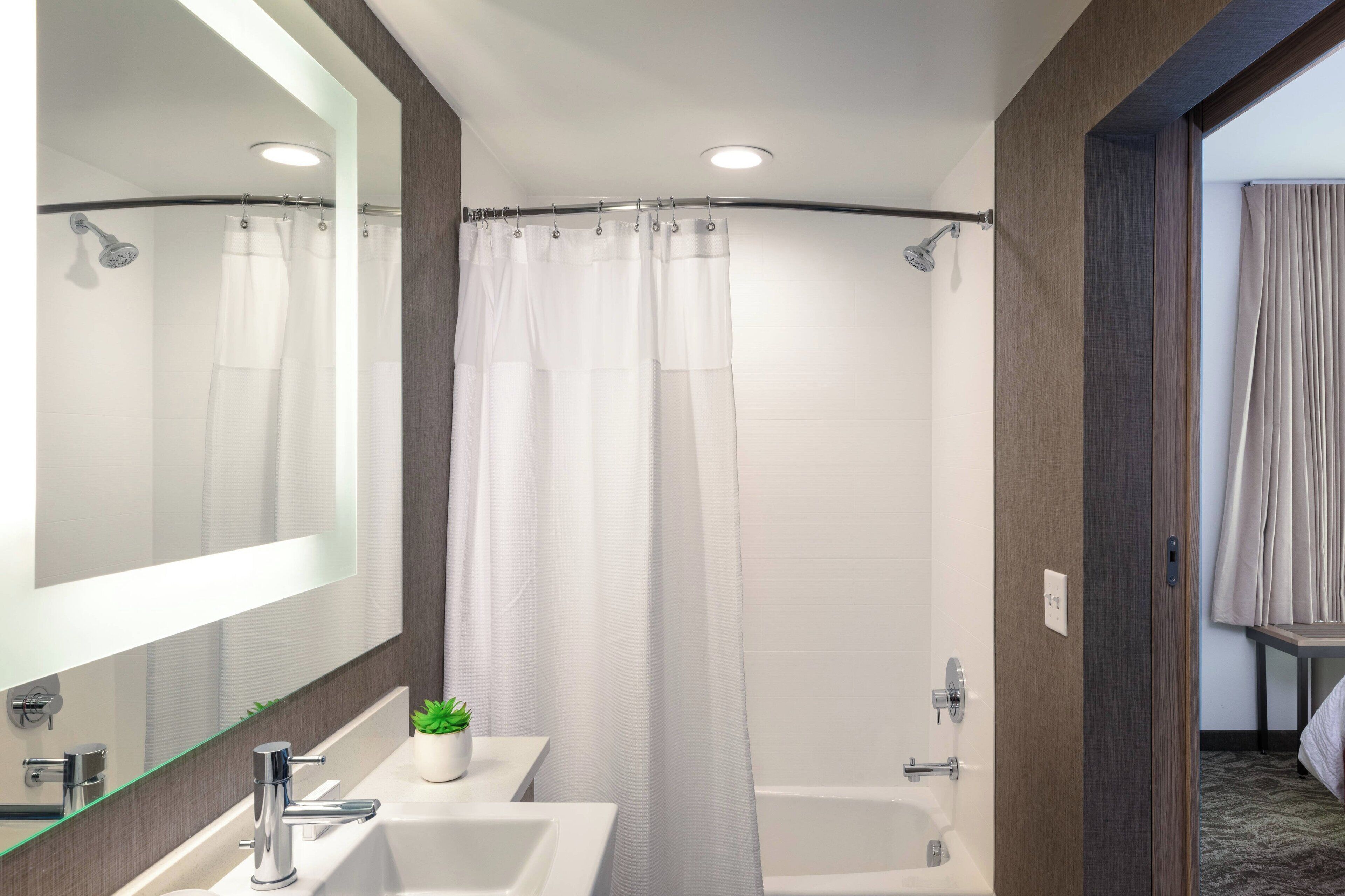 suite, 2 queen beds | bathroom | combined shower/bathtub, free toiletries, hair dryer, towels