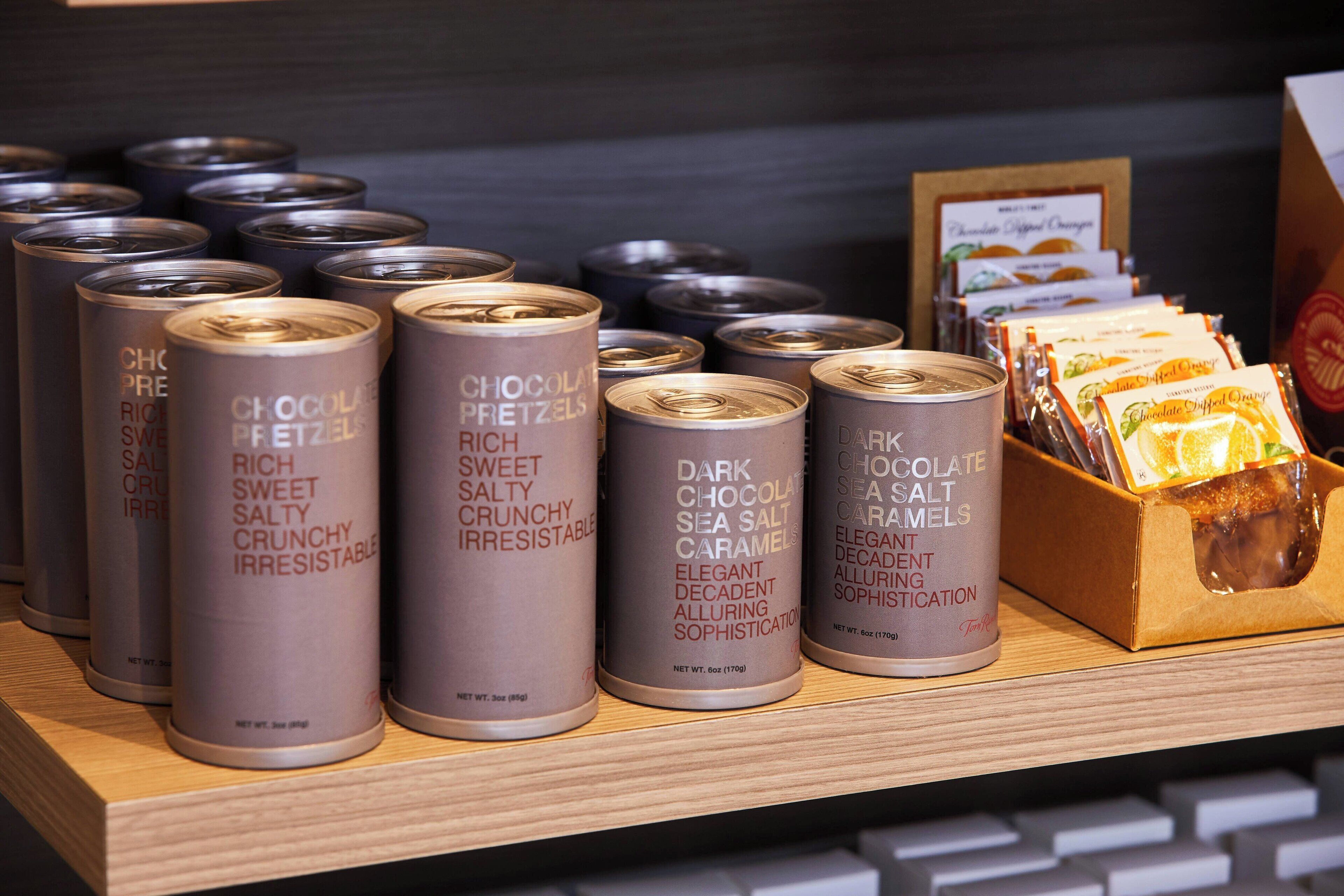 A display of chocolate products including pretzels and caramel candies.
