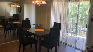 A dining area with a marble table, black chairs, and a chandelier. - Bright and Peaceful condo 2 bedrooms  2 bath comfortable clean Great location! (Phoenix)